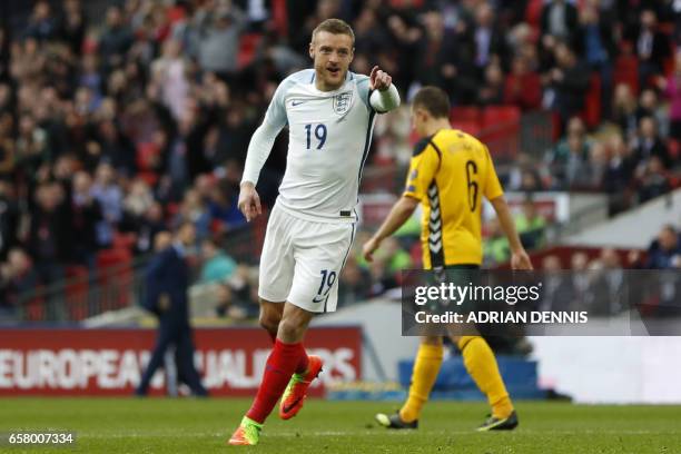 England's striker Jamie Vardy celebrates after scoring their second goal during the World Cup 2018 qualification football match between England and...