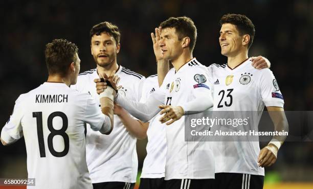 Thomas Mueller celebrates scoring the second goal with Joshua Kimmich, Mario Gomez and Jonas Hector during the FIFA 2018 World Cup Qualifiying group...