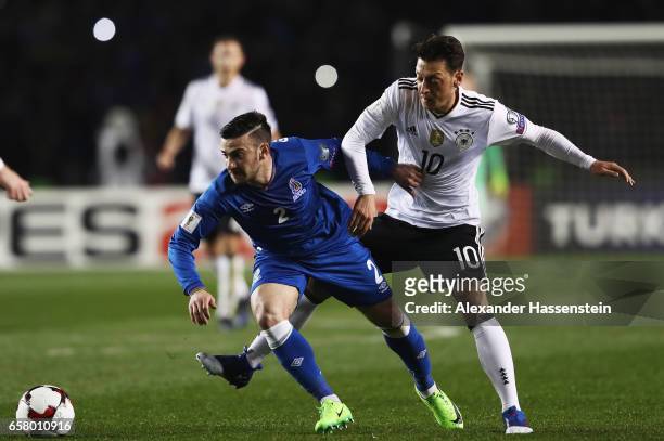 Mesut Oezil of Germany is challenged by Gara Garayev of Azerbaijan during the FIFA 2018 World Cup Qualifiying group C match between Azerbaijan and...