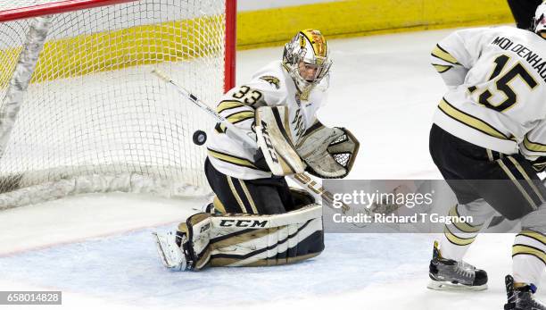 Ben Blacker of the Western Michigan Broncos makes a save against the Air Force Falcons during game two of the NCAA Division I Men's Ice Hockey East...