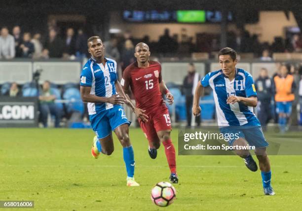Honduras midfielder Andy Najar moves the ball up field while teammate Honduras defender Brayan Beckeles and U.S. Midfielder Darlington Nagbe pursue...