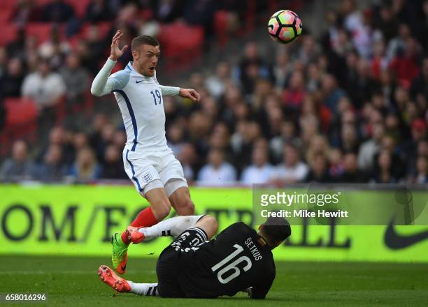 Jamie Vardy of England is closed down by Ernestas Setkus of Lithuania during the FIFA 2018 World Cup Qualifier between England and Lithuania at...