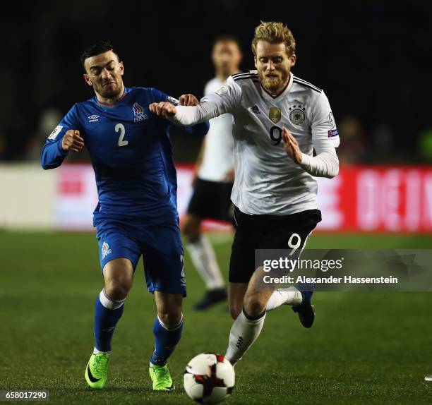 André Schürrle of Germany is challenged by Gara Garayev of Azerbaijan during the FIFA 2018 World Cup Qualifiying group C match between Azerbaijan and...