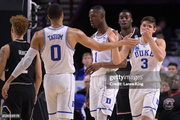 Jayson Tatum and Grayson Allen of the Duke Blue Devils react following a play against the South Carolina Gamecocks during the second round of the...