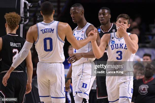 Jayson Tatum and Grayson Allen of the Duke Blue Devils react following a play against the South Carolina Gamecocks during the second round of the...