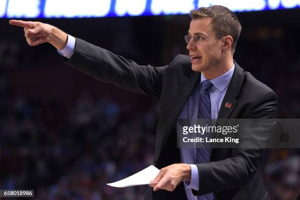 Assistant coach Jon Scheyer of the Duke Blue Devils gives instructions during their game against the South Carolina Gamecocks during the second round...