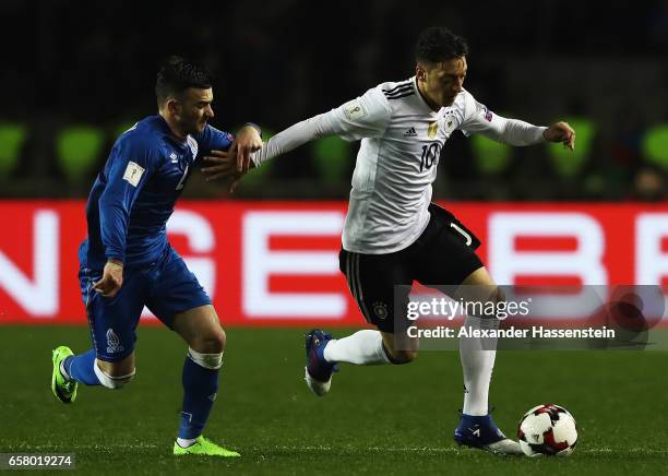 Mesut Oezil of Germany challenges Gara Garayev of Azerbaijan during the FIFA 2018 World Cup Qualifiying group C match between Azerbaijan and Germany...