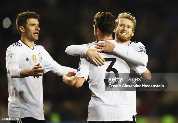 André Schürrle of Germany celebrates scoring the fourth goal with Thomas Mueller and Jonas Hector during the FIFA 2018 World Cup Qualifiying group C...