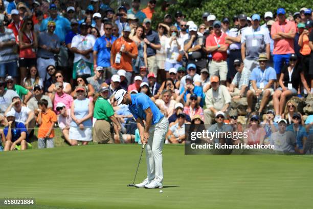 Dustin Johnson putts on the 18th hole of his match during the semifinals of the World Golf Championships-Dell Technologies Match Play at the Austin...