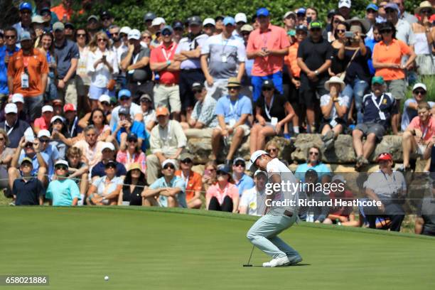 Hideto Tanihara of Japan reacts after putting on the 18th hole of his match during the semifinals of the World Golf Championships-Dell Technologies...