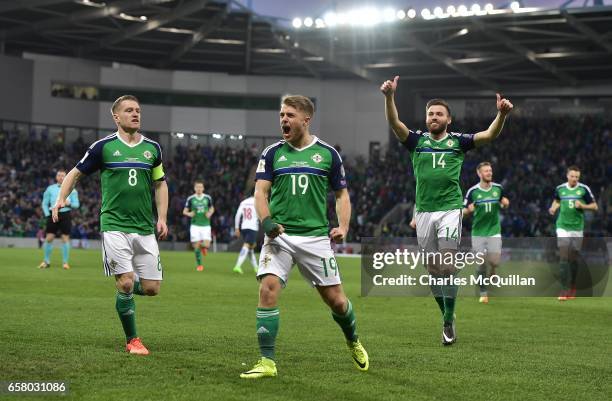 Jamie Ward of Northern Ireland celebrates scoring with team mates during the FIFA 2018 World Cup Qualifier between Northern Ireland and Norway at...