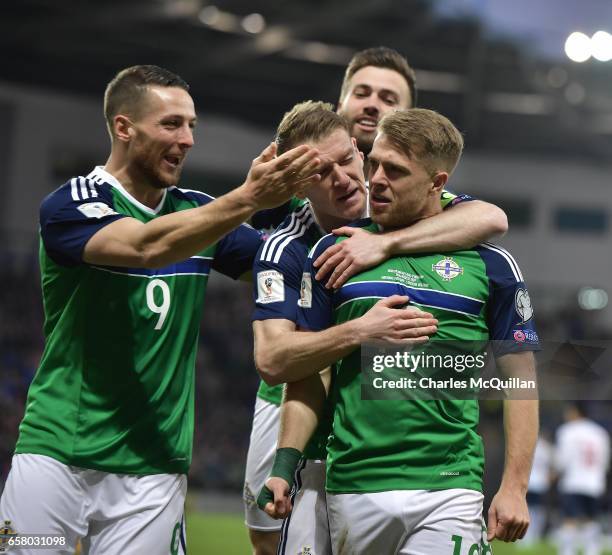 Jamie Ward of Northern Ireland celebrates scoring with team mates during the FIFA 2018 World Cup Qualifier between Northern Ireland and Norway at...