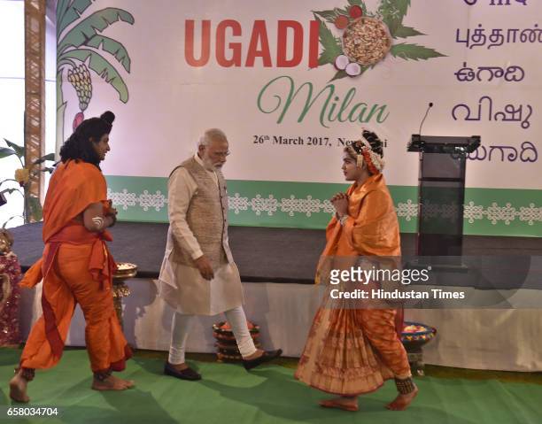 Prime Minister Narendra Modi during the celebration on the occasion of "Ugadi" according to Hindu Calendar at Venkaiah Naidu's residence on March 26,...