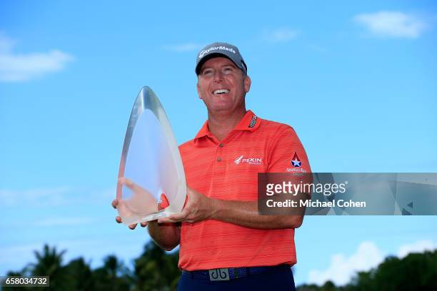 Points holds the trophy after winning the Puerto Rico Open at Coco Beach on March 26, 2017 in Rio Grande, Puerto Rico.