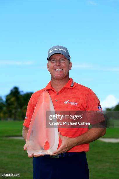 Points holds the trophy after winning the Puerto Rico Open at Coco Beach on March 26, 2017 in Rio Grande, Puerto Rico.