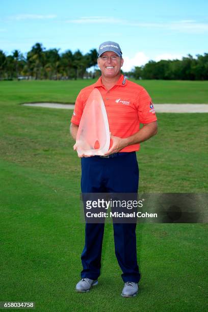 Points holds the trophy after winning the Puerto Rico Open at Coco Beach on March 26, 2017 in Rio Grande, Puerto Rico.