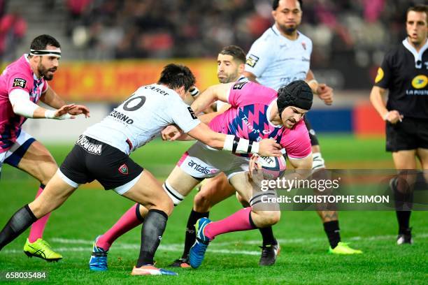 Stade Francais' New Zealander lock Hugh Pyle vies with RC Toulon's French flyhalf François Trinh-Duc during during their Top14 match Stade Francais...