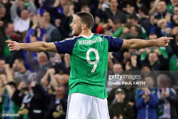 Northern Ireland's forward Conor Washington celebrates after scoring their second goal during the World Cup 2018 qualification football match between...