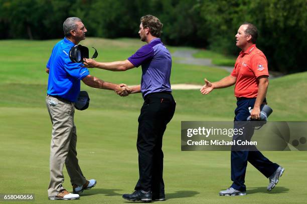 Points, Chris Stroud, and Bill Lunde shake hands after the final round of the Puerto Rico Open at Coco Beach on March 26, 2017 in Rio Grande, Puerto...