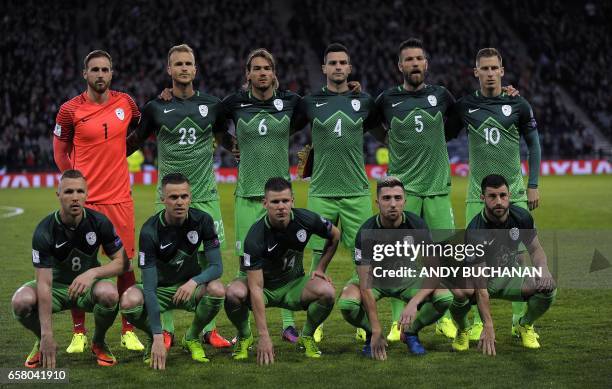 Slovenian players Slovenia's goalkeeper Jan Oblak, Slovenia's defender Aljaz Struna, Slovenia's midfielder Rene Krhin, Slovenia's defender Miral...