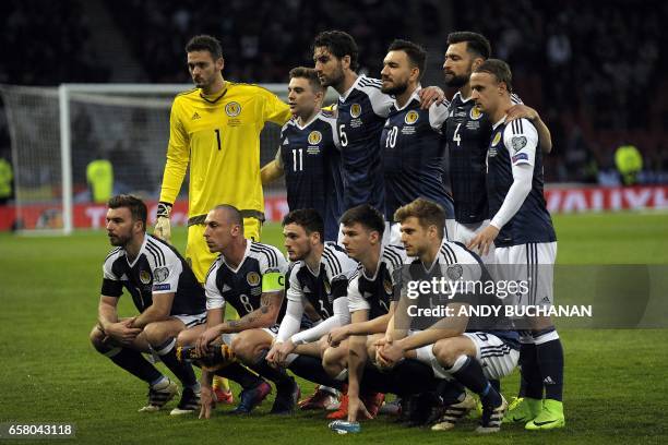 Scotland players Scotland's goalkeeper Craig Gordon, Scotland's midfielder James Forrest, Scotland's defender Charlie Mulgrew, Scotland's forward...