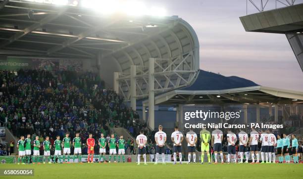 Northern Ireland and Norway players pay respect to Ryan Mc Bride before kick off during the World Cup Qualifying match at Windsor Park, Belfast.