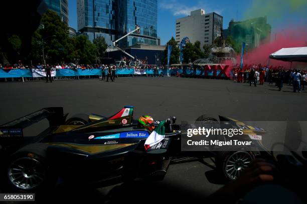 Mexican FE pilot Esteban Gutierrez drives his car during the Formual E Road Show at Reforma Avenue on March 25, 2017 in Mexico City, Mexico.