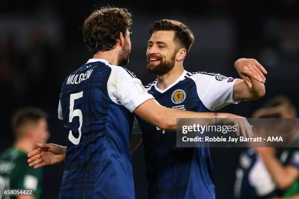 Charlie Mulgrew of Scotland and Russell Martin of Scotland celebrate at full time during the FIFA 2018 World Cup Qualifier between Scotland and...