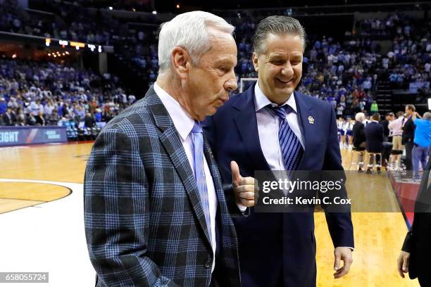 Head coach Roy Williams of the North Carolina Tar Heels and head coach John Calipari of the Kentucky Wildcats walk off the court before their game...