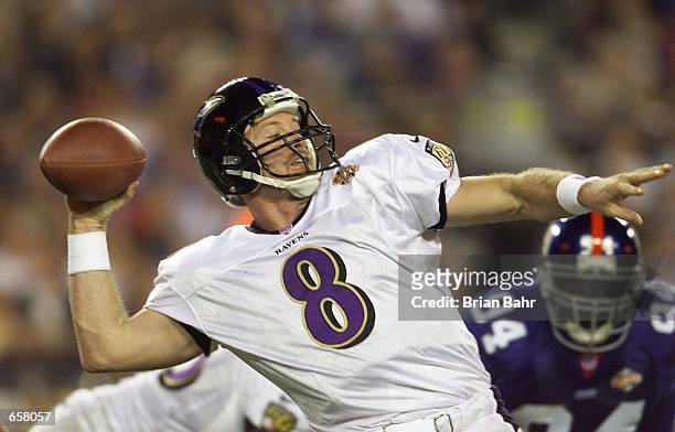 Quarterback Trent Dilfer of the Baltimore Ravens drops back to pass during Super Bowl XXXV against the New York Giants at Raymond James Stadium in...
