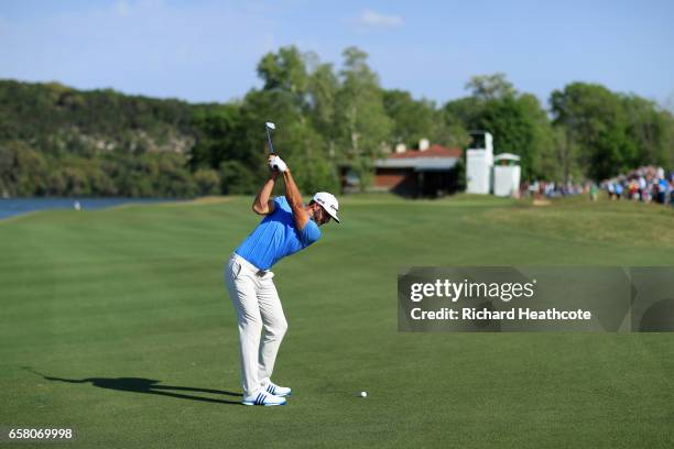 Dustin Johnson plays a shot on the 14th hole during the final match of the World Golf Championships-Dell Technologies Match Play at the Austin...