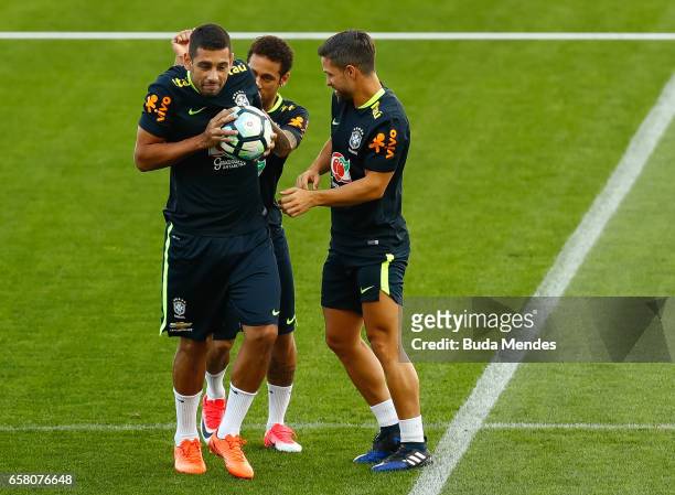 Diego Souza, Diego and Neymar of Brazil joke during a training session at Arena Corinthians on March 26, 2017 in Sao Paulo, Brazil.
