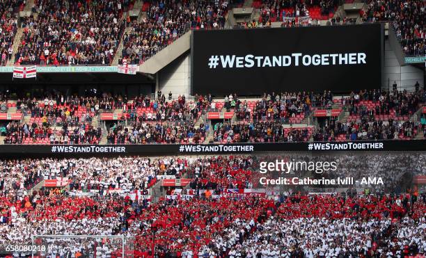 Flag of England, St Georges Cross, can be seen underneath the hashtag westandtogether during the FIFA 2018 World Cup Qualifier between England and...