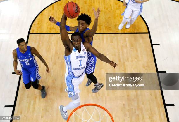 Theo Pinson of the North Carolina Tar Heels drives to the basket against De'Aaron Fox of the Kentucky Wildcats in the second half during the 2017...