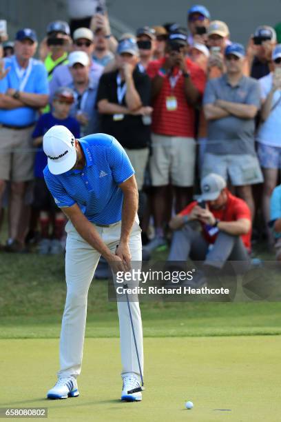 Dustin Johnson putts for par to win the final match of the World Golf Championships-Dell Technologies Match Play over Jon Rahm of Spain 1 up on the...