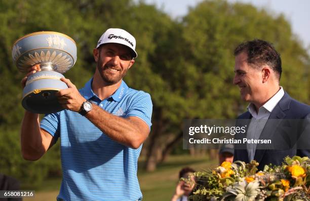 Dustin Johnson celebrates with the trophy after winning the World Golf Championships-Dell Technologies Match Play at the Austin Country Club on March...