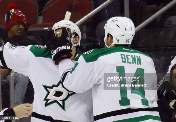 Tyler Seguin of the Dallas Stars scores at 20 seconds of overtime against the New Jersey Devils and is joined by Jamie Benn at the Prudential Center...