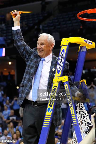 Head coach Roy Williams of the North Carolina Tar Heels cuts down the net after defeating the Kentucky Wildcats during the 2017 NCAA Men's Basketball...