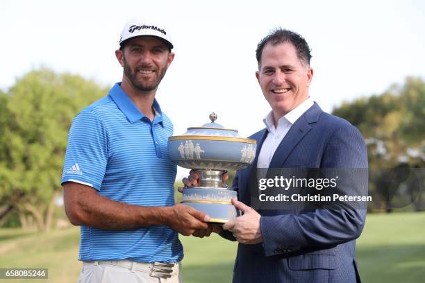 Dustin Johnson and the CEO of Dell Michael Dell pose with the trophy after the World Golf Championships-Dell Technologies Match Play at the Austin...