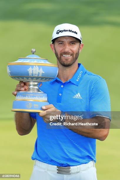 Dustin Johnson of the USA poses with the trophy after winning the World Golf Championships-Dell Technologies Match Play at the Austin Country Club on...