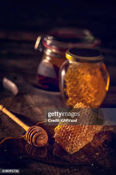 honey with honeycombs in a jar - jar stock pictures, royalty-free photos & images