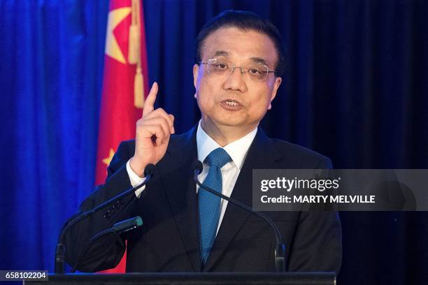 China's Premier Li Keqiang speaks at a joint press conference with New Zealand's Prime Minister Bill English in Wellington on March 27, 2017. Li is...