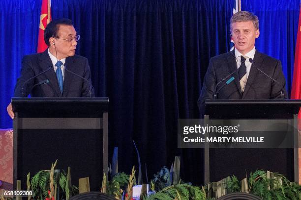 New Zealand's Prime Minister Bill English speaks at a joint press conference with China's Premier Li Keqiang in Wellington on March 27, 2017. Li is...