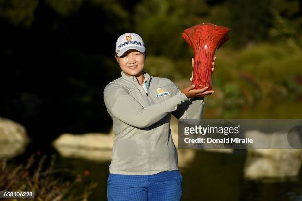 Mirim Lee of Korea holds the winner's trophy after her -20 under par tournament record during the Final Round of the KIA Classic at the Park Hyatt...