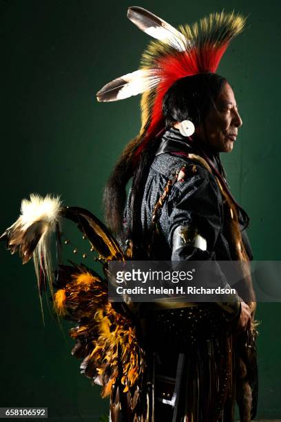 Tome Roubideaux, from the Lakota and Metis Nations, poses for a portrait during the 43rd annual Denver March Powwow at the Denver Coliseum on March...