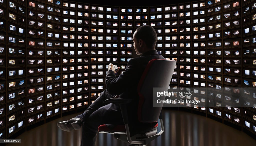 Man watching video on monitors