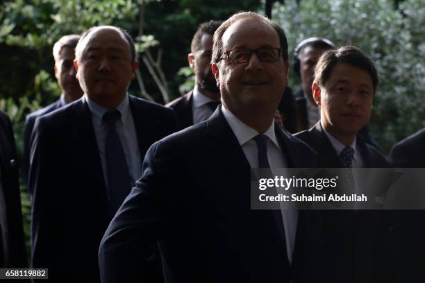 French President Francois Hollande tours the orchid garden after the orchid naming ceremony at the National Orchid Gardens on 27 March, 2017 in...