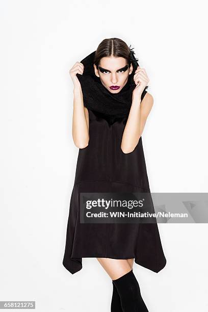 young woman in a black mini dress and scarf - lila lippenstift stock-fotos und bilder