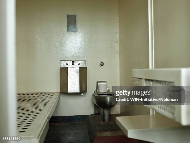 open door to prison cell - celda fotografías e imágenes de stock