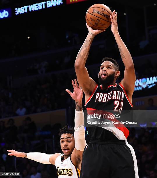 Allen Crabbe of the Portland Trail Blazers gets a shot off past the defense of D'Angelo Russell of the Los Angeles Lakers in the second half of the...